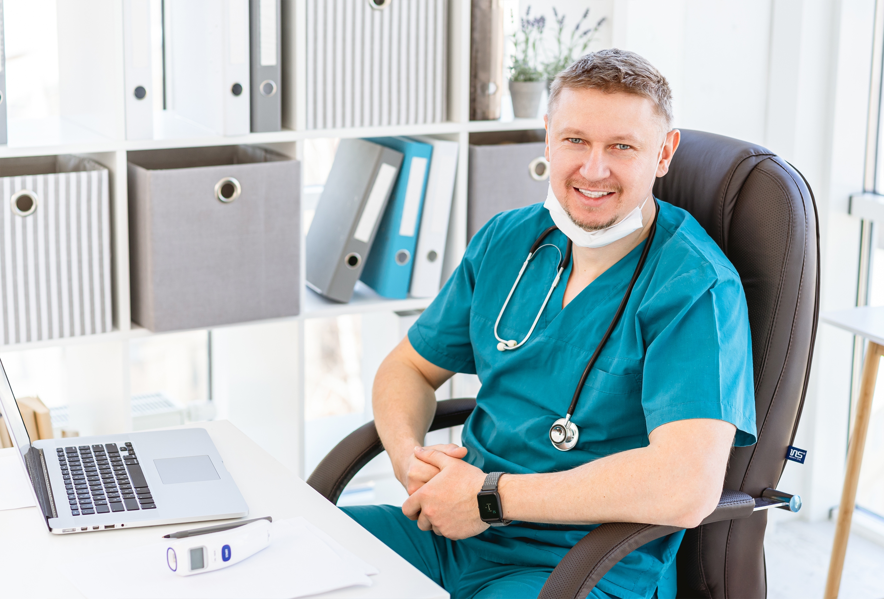 Smiling doctor in light office